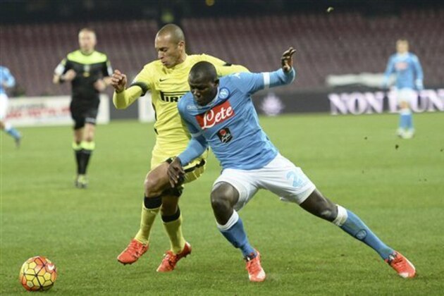 Inter defender Miranda, left, and Napoli's defender Kalidou Koulibaly vie for the ball during their Italian Cup soccer match between Napoli and Inter Milan, at the San Paolo stadium in Naples, Italy, Tuesday, Jan. 19, 2016 . (Ciro Fusco/ANSA via AP Photo) ITALY OUT
