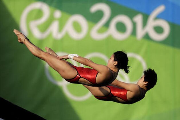 China's Liu Huixia and Chen Ruolin compete during the women's synchronized 10-meter platform diving final in the Maria Lenk Aquatic Center at the 2016 Summer Olympics in Rio de Janeiro, Brazil, Tuesday, Aug. 9, 2016. (AP Photo/Wong Maye-E)