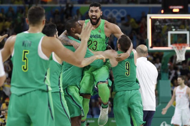 Brazil's Augusto Lima (23) celebrates with teammates after heir win over Spain in a men's basketball game at the 2016 Summer Olympics in Rio de Janeiro, Brazil, Tuesday, Aug. 9, 2016. (AP Photo/Eric Gay) Brazil's Augusto Lima (23) celebrates with teammates after heir win over Spain in a men's basketball game at the 2016 Summer Olympics in Rio de Janeiro, Brazil, Tuesday, Aug. 9, 2016. (AP Photo/Eric Gay)