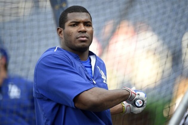 Los Angeles Dodgers' Yasiel Puig looks on during batting practice before a baseball game against the Washington Nationals, Tuesday, July 19, 2016, in Washington. (AP Photo/Nick Wass)