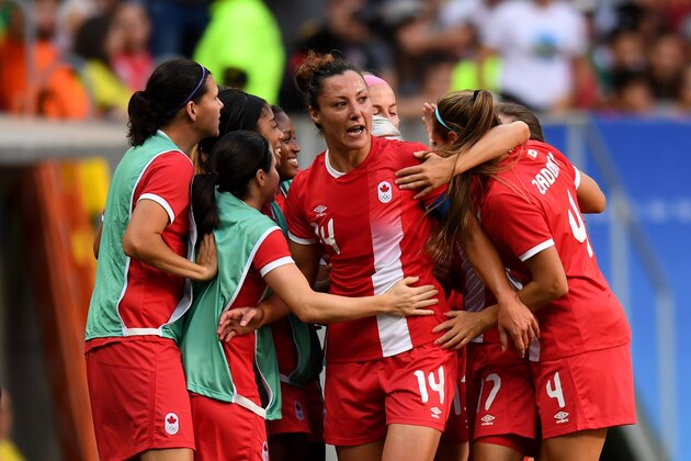 Canada player Melissa Tancredi (C) celebrates with teammates after scoring during the Rio 2016 Olympic Games First Round Group F women's football match Germany vs Canada, at the Mane Garrincha Stadium in Brasilia on August 9, 2016. / AFP / EVARISTO SA        (Photo credit should read EVARISTO SA/AFP/Getty Images)