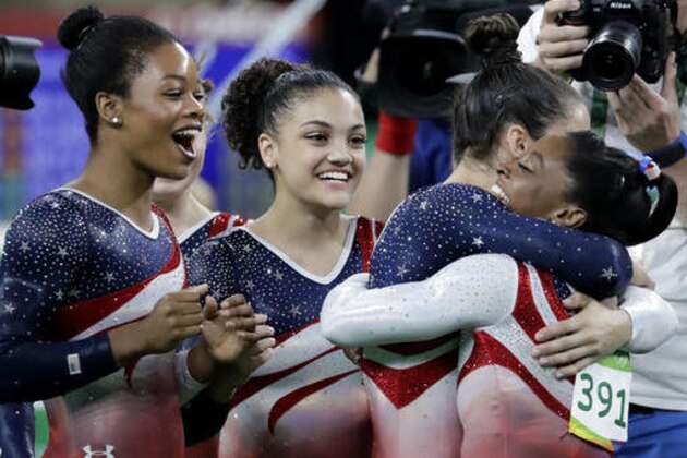 U.S. gymnasts, left to right, Gabrielle Douglas, Lauren Hernandez, Aly Raisman and Simone Biles celebrate at the end of the artistic gymnastics women's team final at the 2016 Summer Olympics in Rio de Janeiro, Brazil, Tuesday, Aug. 9, 2016.(AP Photo/Charlie Riedel)