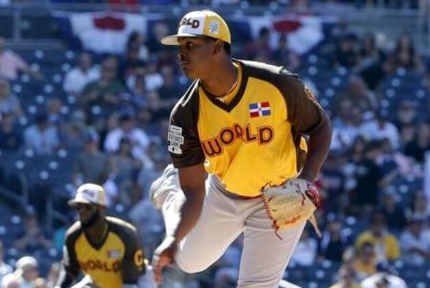 World Team starting pitcher Alex Reyes, of the St. Louis Cardinals, throws against the U.S. Team during the first inning of the All-Star Futures baseball game, Sunday, July 10, 2016, in San Diego. (AP Photo/Lenny Ignelzi)