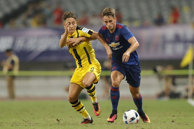 SHANGHAI, CHINA - JULY 22:  Adnan Januzaj (R) of Manchester United competes for the ball with Jacob Bruun Larsen of Borussia Dortmund
during the International Champions Cup match between Manchester United and Borussia Dortmund at Shanghai Stadium on July 22, 2016 in Shanghai, China.  (Photo by Lintao Zhang/Getty Images)
