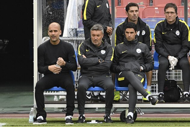 Manchester City's Spanish head coach Pep Guardiola (L) reacts during the friendly football match between Arsenal and Manchester City at the Ullevi stadium in Gothenburg on August 7, 2016. / AFP / JONATHAN NACKSTRAND        (Photo credit should read JONATHAN NACKSTRAND/AFP/Getty Images)