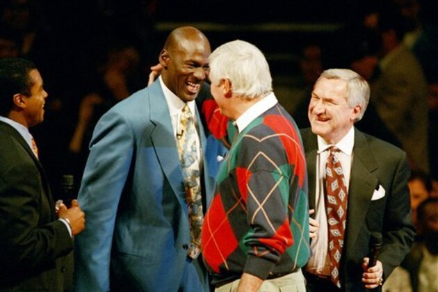 Former Chicago Bulls great Michael Jordan jokes with Indiana basketball coach Bobby Knight, center, as Dean Smith, Jordan's former coach at North Carolina looks on during a special tribute to Jordan in Chicago, Ill., Nov. 1, 1994. (AP Photo/John Zich)