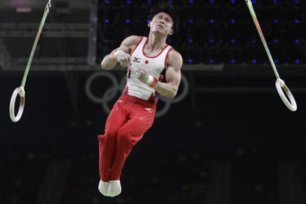Japan's Kohei Uchimura performs on the rings during the artistic gymnastics men's qualification at the 2016 Summer Olympics in Rio de Janeiro, Brazil, Saturday, Aug. 6, 2016. (AP Photo/Dmitri Lovetsky)