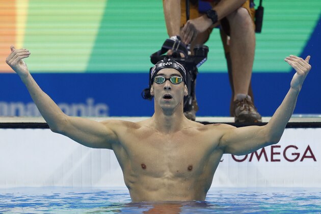 USA's Michael Phelps celebrates after he won the Men's 200m Butterfly Final during the swimming event at the Rio 2016 Olympic Games at the Olympic Aquatics Stadium in Rio de Janeiro on August 9, 2016.   / AFP / Odd Andersen        (Photo credit should read ODD ANDERSEN/AFP/Getty Images)