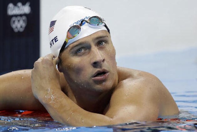 United States' Ryan Lochte checks his time in a men's 4x200-meter freestyle heat during the swimming competitions at the 2016 Summer Olympics, Tuesday, Aug. 9, 2016, in Rio de Janeiro, Brazil. (AP Photo/Michael Sohn)