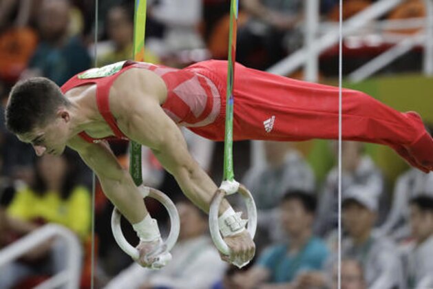 Britain's Max Whitlock performs on the rings during the artistic gymnastics men's team final at the 2016 Summer Olympics in Rio de Janeiro, Brazil, Monday, Aug. 8, 2016. (AP Photo/Rebecca Blackwell)