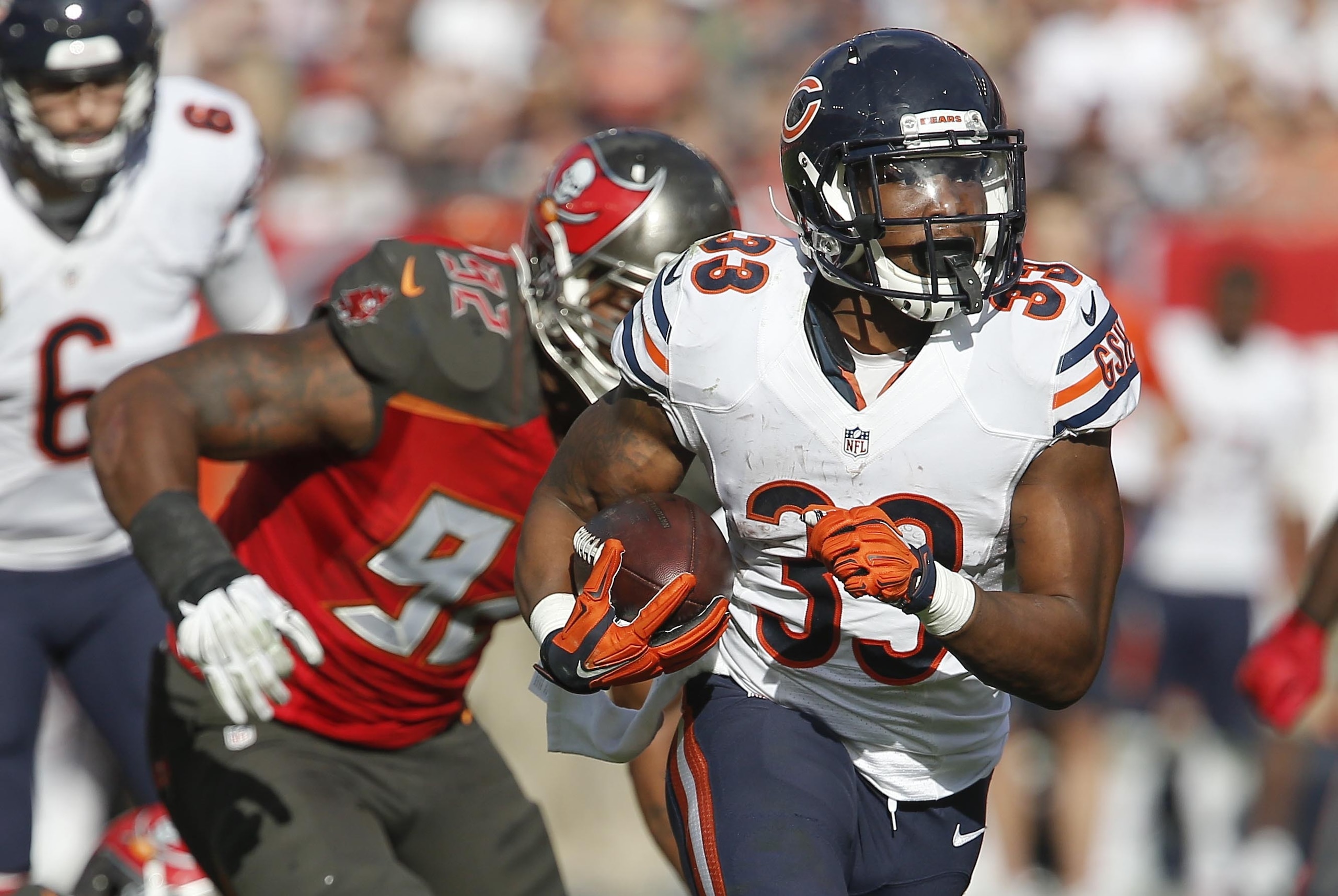 Dec 27, 2015; Tampa, FL, USA; Tampa Bay Buccaneers defensive end William Gholston (92) chases Chicago Bears running back Jeremy Langford (33) during the second half of a football game at Raymond James Stadium. The Bears won 26-12. Mandatory Credit: Reinhold Matay-USA TODAY Sports
