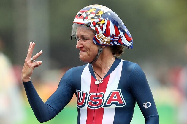 RIO DE JANEIRO, BRAZIL - AUGUST 10:  Kristin Armstrong of the United States holds up three fingers after winning her third consecutive gold medal in the Women's Individual Time Trial on Day 5 of the Rio 2016 Olympic Games at Pontal on August 10, 2016 in Rio de Janeiro, Brazil.  (Photo by Bryn Lennon/Getty Images)