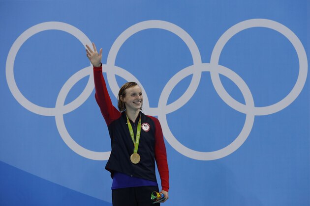 USA's Katie Ledecky poses on the podium with her gold medal after she won the Women's 200m Freestyle Final during the swimming event at the Rio 2016 Olympic Games at the Olympic Aquatics Stadium in Rio de Janeiro on August 9, 2016.   / AFP / Odd ANDERSEN        (Photo credit should read ODD ANDERSEN/AFP/Getty Images)