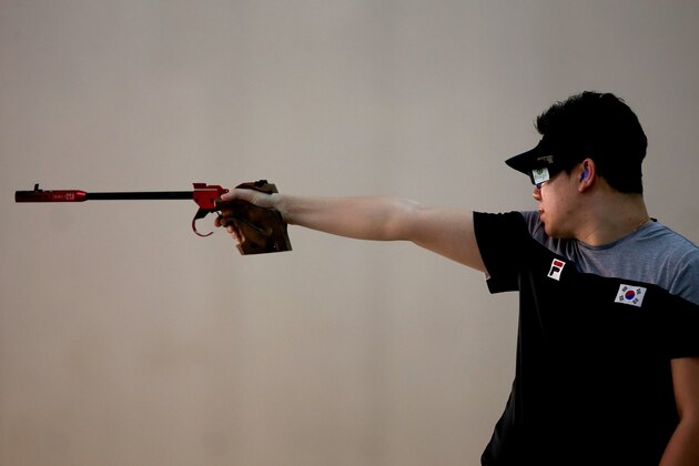 RIO DE JANEIRO, BRAZIL - APRIL 19:  World recod holder and Olympic gold medalist Jongoh Jin of South Korea competes in the men 50m Pistol competition during the International Shooting Tournament  - Aquece Rio Test Event for the Rio 2016 Olympics at the Olympic Shooting Center in Deodoro Olympic Park on April 19, 2016 in Rio de Janeiro, Brazil.  (Photo by Matthew Stockman/Getty Images)