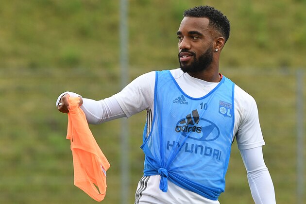 Lyon's French forward Alexandre Lacazette gestures during a training session on August 05, 2016, at the Woerthersee stadium in Klagenfurt, on the eve of the French Trophy of Champions football match between Olympique de Lyon and Paris Saint-Germain. / AFP / BORIS HORVAT        (Photo credit should read BORIS HORVAT/AFP/Getty Images)