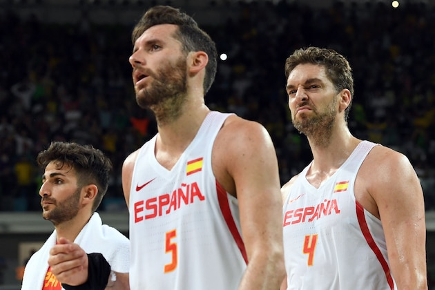 Spain's centre Pau Gasol (R), Spain's small forward Rudy Fernandez (C) and Spain's point guard Ricky Rubio leave the court after Brazil defeated Spain during a Men's round Group B basketball match between Spain and Brazil at the Carioca Arena 1 in Rio de Janeiro on August 9, 2016 during the Rio 2016 Olympic Games. / AFP / Mark RALSTON        (Photo credit should read MARK RALSTON/AFP/Getty Images)