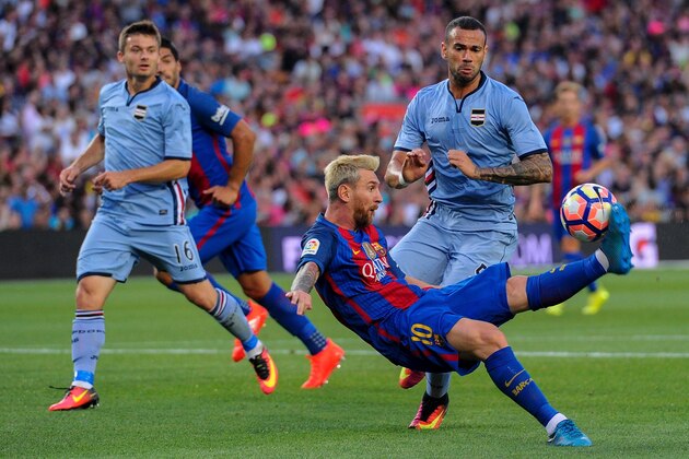 Barcelona's Argentinian forward Lionel Messi (down) vies with Sampdoria's Brazilian defender Leandro Castan during the annual 51st Joan Gamper Trophy friendly football match beteen Barcelona FC and UC Sampdoria at the Camp Nou stadium in Barcelona on August 10, 2016. / AFP / JOSEP LAGO        (Photo credit should read JOSEP LAGO/AFP/Getty Images)