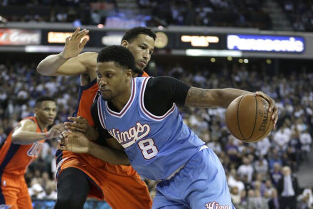 Sacramento Kings forward Rudy Gay, right, drives against Oklahoma City Thunder guard Andre Roberson during the second half of an NBA basketball game Saturday, April 9, 2016, in Sacramento, Calif. The Kings won 114-112. (AP Photo/Rich Pedroncelli)