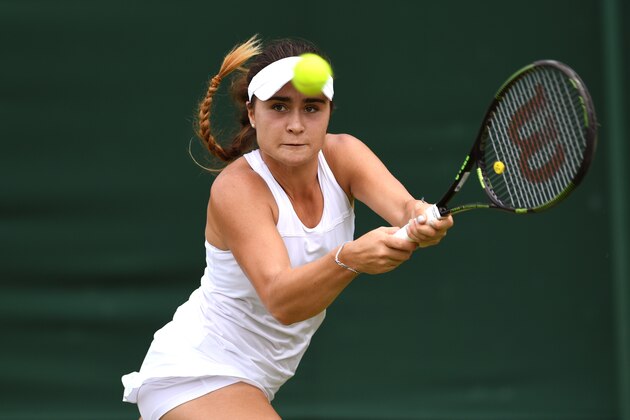 LONDON, ENGLAND - JULY 03:  Gabriella Taylor of Great Britain plays a backhand during the Girl's singles first round match against Morgan Coppoc of The United States on Middle Sunday of the Wimbledon Lawn Tennis Championships at the All England Lawn Tennis and Croquet Club on July 3, 2016 in London, England.  (Photo by Shaun Botterill/Getty Images)