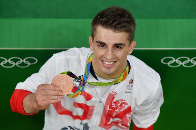 Bronze medallist Britain's Max Whitlock poses with his medal after the men's individual all-around final of the Artistic Gymnastics at the Olympic Arena during the Rio 2016 Olympic Games in Rio de Janeiro on August 10, 2016. / AFP / Ben STANSALL        (Photo credit should read BEN STANSALL/AFP/Getty Images)