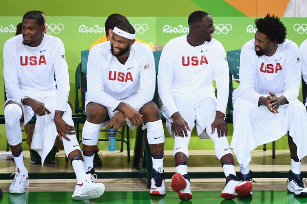 RIO DE JANEIRO, BRAZIL - AUGUST 08: Kevin Durant #5, DeAndre Jordan #6, Draymond Green #14 and DeAndre Jordan #6 of United States laugh on the bench near the end of regulation in a win during the Men's Preliminary Round between the United States and Venezuela on Day 3 of the Rio 2016 Olympic Games at the Carioca Arena 1 on August 8, 2016 in Rio de Janeiro, Brazil.  (Photo by David Ramos/Getty Images)