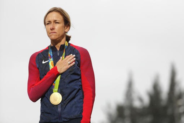 Gold medalist Kristin Armstrong of the United States stands during the podium ceremony of the women's individual time trial event at the 2016 Summer Olympics in Pontal beach, Rio de Janeiro, Brazil, Wednesday, Aug. 10, 2016. (AP Photo/Patrick Semansky)
