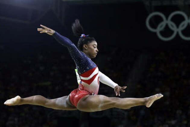 United States' Simone Biles performs on the balance beam during the artistic gymnastics women's team final at the 2016 Summer Olympics in Rio de Janeiro, Brazil, Tuesday, Aug. 9, 2016. (AP Photo/Rebecca Blackwell)
