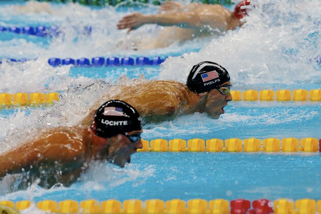 RIO DE JANEIRO, BRAZIL - AUGUST 10:  Michael Phels of United States in action with Ryan Lochte of United States during the semifinal men's 200m individual medley at Olympic Aquatics Stadium on August 10, 2016 in Rio de Janeiro, Brazil.  (Photo by Xavier Laine/Getty Images)