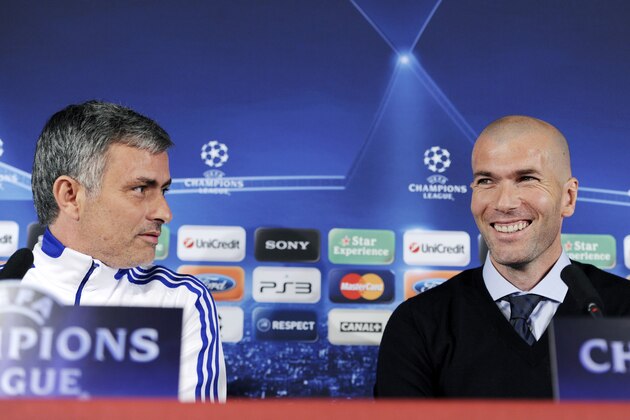 Former French football player Zinedine Zidane smiles near Real Madrid's Portuguese coach Jose Mourinho (L) during a press conference on the eve of UEFA Champions league football match Lyon versus Real Madrid on February 21, 2011 at the Gerland stadium in Lyon. AFP PHOTO/PHILIPPE DESMAZES (Photo credit should read PHILIPPE DESMAZES/AFP/Getty Images)