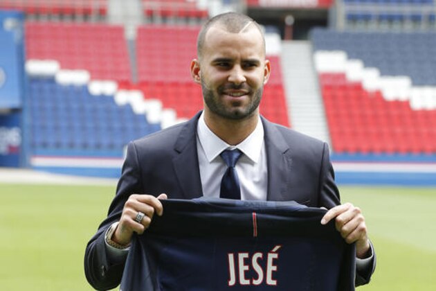 Spanish soccer player Jese Rodrigez, poses with his new Paris Saint Germain jersey at Parc des Princes stadium in Paris, Monday, Aug. 8, 2016. French champion Paris Saint-Germain bolstered its attack by recruiting Spanish forward Jese on a five-year deal from Real Madrid. (AP Photo/Michel Euler)