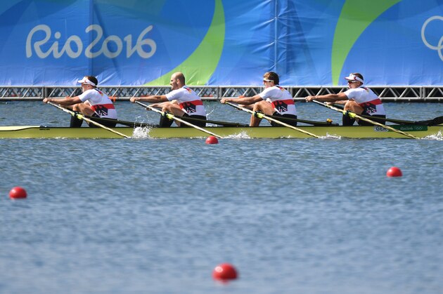(From L) Germany's Hans Gruhne, Germany's Karl Schulze, Germany's Lauritz Schoof and Germany's Philipp Wende row during the Men's Quadruple Sculls final rowing competition at the Lagoa stadium during the Rio 2016 Olympic Games in Rio de Janeiro on August 11, 2016. / AFP / Damien MEYER        (Photo credit should read DAMIEN MEYER/AFP/Getty Images)