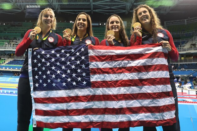 RIO DE JANEIRO, BRAZIL - AUGUST 10:  Katie Ledecky, Maya Dirado, Leah Smith and Allison Schimdt of United Statesvpose with their Gold medals from the Women's 4 x 20m Freestyle Relay on Day 5 of the Rio 2016 Olympic Games at the Olympic Aquatics Stadium on August 10, 2016 in Rio de Janeiro, Brazil. (Photo by Ian MacNicol/Getty Images)