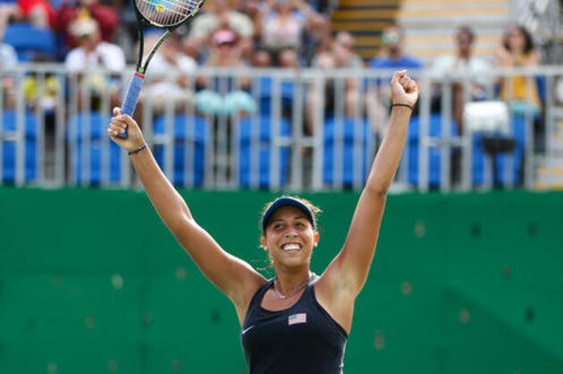Madison Keys of the United States celebrates defeating France's Kristina Mladenovic in the women's tennis competition at the 2016 Summer Olympics in Rio de Janeiro, Brazil, Monday, Aug. 8, 2016. (AP Photo/Vadim Ghirda)
