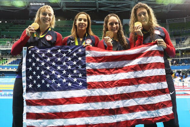 RIO DE JANEIRO, BRAZIL - AUGUST 10:  Katie Ledecky, Maya Dirado, Leah Smith and Allison Schimdt of United Statesvpose with their Gold medals from the Women's 4 x 20m Freestyle Relay on Day 5 of the Rio 2016 Olympic Games at the Olympic Aquatics Stadium on August 10, 2016 in Rio de Janeiro, Brazil. (Photo by Ian MacNicol/Getty Images)