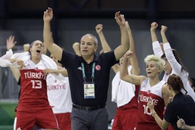 CORRECTS HEAD COACH TO EKREM MEMNUN FROM ANATOLI BUYALSKI - Belarus head coach Ekrem Memnun and team react after a score during the first half of a women's basketball game against Turkey at the Youth Center at the 2016 Summer Olympics in Rio de Janeiro, Brazil, Thursday, Aug. 11, 2016. (AP Photo/Carlos Osorio)