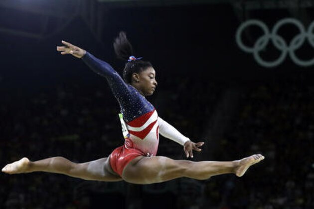 United States' Simone Biles performs on the balance beam during the artistic gymnastics women's team final at the 2016 Summer Olympics in Rio de Janeiro, Brazil, Tuesday, Aug. 9, 2016. (AP Photo/Rebecca Blackwell)