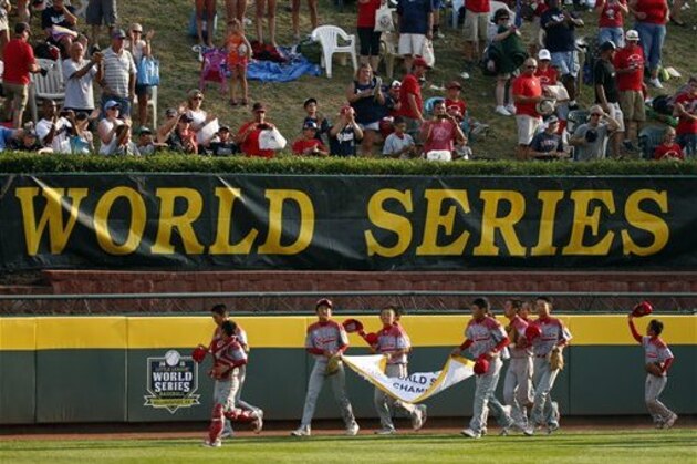 The Little League World Champions from Japan take a victory lap of the outfield at Lamade Stadium after the Little League World Series Championship baseball game against Lewisberry, Pa. in South Williamsport, Pa., Sunday, Aug. 30, 2015. Japan won 18-11. (AP Photo/Gene J. Puskar)