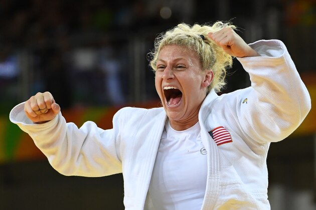 US Kayla Harrison celebrates after defeating France's Audrey Tcheumeo during their women's -78kg judo contest gold medal match of the Rio 2016 Olympic Games in Rio de Janeiro on August 11, 2016. / AFP / Toshifumi KITAMURA        (Photo credit should read TOSHIFUMI KITAMURA/AFP/Getty Images)
