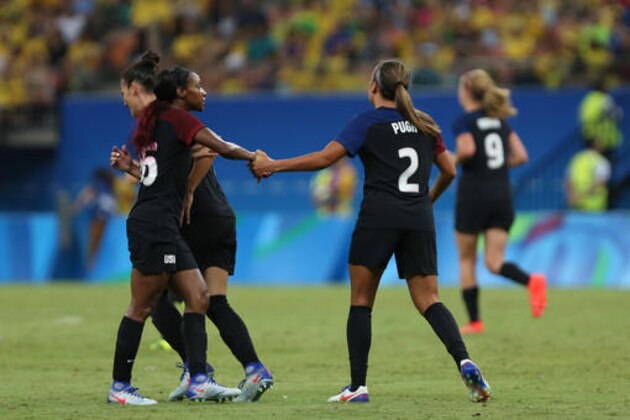 United States' Crystal Dunn, left, and Mallory Pugh, 2, shake hands as they celebrate scoring their side's 2nd goal during a group G match of the women's Olympic football tournament between Colombia and United States at the Arena Amazonia stadium in Manaus, Brazil, Tuesday, Aug. 9, 2016. The game ended in a 2-2 draw. (AP Photo/Michael Dantas)