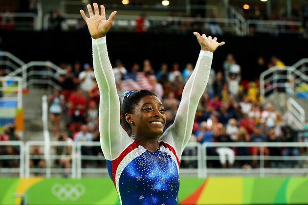 RIO DE JANEIRO, BRAZIL - AUGUST 11:  Simone Biles of the United States waves to fans after winning the gold medal during the Women's Individual All Around Final on Day 6 of the 2016 Rio Olympics at Rio Olympic Arena on August 11, 2016 in Rio de Janeiro, Brazil.  (Photo by Alex Livesey/Getty Images)