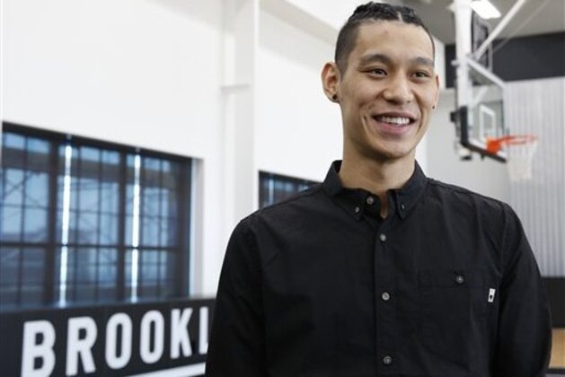 Brooklyn Nets newly acquired guard Jeremy Lin smiles during an interview following a press conference to introduce the team's new players Wednesday, July 20, 2016, in New York.  (AP Photo/Kathy Willens)