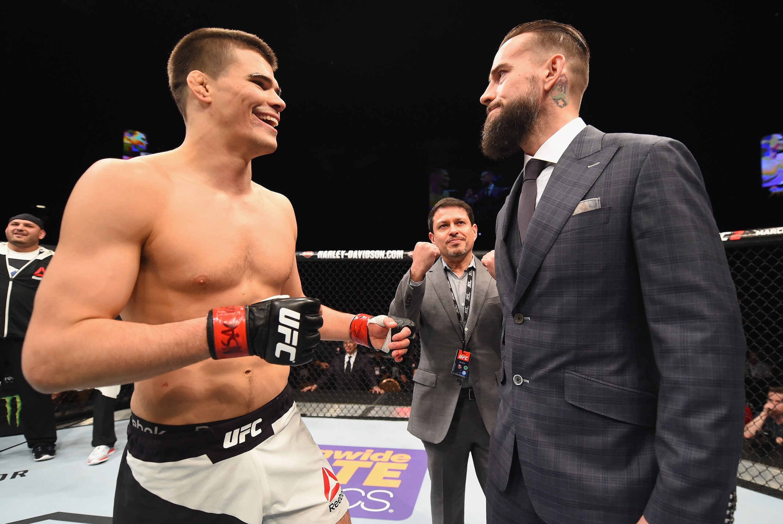 LAS VEGAS, NV - FEBRUARY 06:  (R-L) Phil 'CM Punk' Brooks faces off with Mickey Gall after Gall's victory over Mike Jackson during the UFC Fight Night event at MGM Grand Garden Arena on February 6, 2016 in Las Vegas, Nevada.  (Photo by Jeff Bottari/Zuffa LLC/Zuffa LLC via Getty Images)