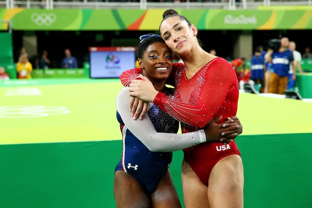 RIO DE JANEIRO, BRAZIL - AUGUST 11:  Simone Biles (L) of the United States waits for the score after competing on the floor with Alexandra Raisman (R) during the Women's Individual All Around Final on Day 6 of the 2016 Rio Olympics at Rio Olympic Arena on August 11, 2016 in Rio de Janeiro, Brazil.  (Photo by Alex Livesey/Getty Images)