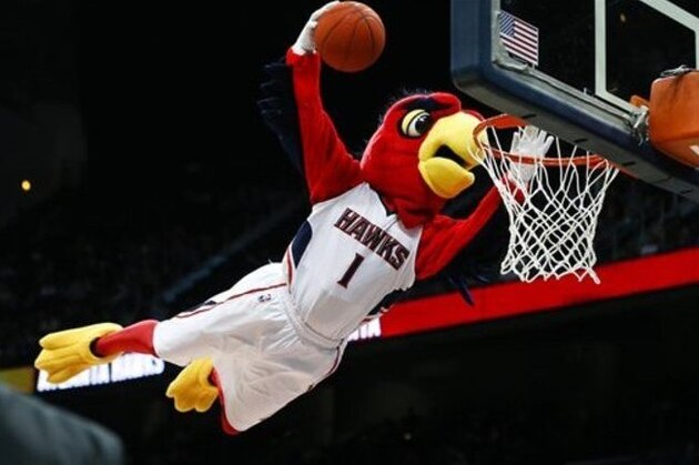 Atlanta Hawks mascot Harry the Hawk performs for the crowd during a timeout  in the second half of an NBA basketball game against the Boston Celtics Tuesday, Dec. 2, 2014, in Atlanta. Atlanta won 109-105. (AP Photo/John Bazemore)
