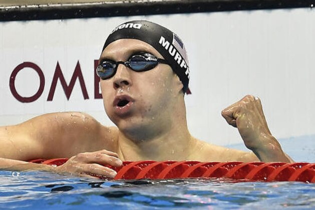 United States' Ryan Murphy celebrates after winning the gold medal in the men's 200-meter backstroke final during the swimming competitions at the 2016 Summer Olympics, Thursday, Aug. 11, 2016, in Rio de Janeiro, Brazil. (AP Photo/Martin Meissner)
