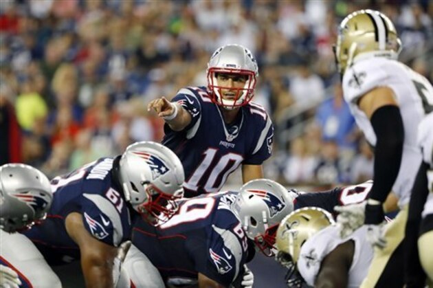 New England Patriots quarterback Jimmy Garoppolo (10) calls signal at the line of scrimmage during the first half of a preseason NFL football game against the New Orleans Saints Thursday, Aug. 11, 2016, in Foxborough, Mass. (AP Photo/Winslow Townson)