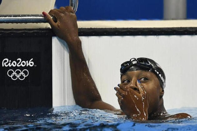 United States' Simone Manuel celebrates after winning the gold medal in the women's 100-meter freestyle final during the swimming competitions at the 2016 Summer Olympics, Thursday, Aug. 11, 2016, in Rio de Janeiro, Brazil. (AP Photo/Martin Meissner)