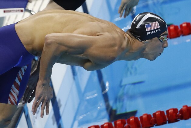 USA's Michael Phelps dives in the Men's 100m Butterfly Semifinal during the swimming event at the Rio 2016 Olympic Games at the Olympic Aquatics Stadium in Rio de Janeiro on August 11, 2016.   / AFP / Odd Andersen        (Photo credit should read ODD ANDERSEN/AFP/Getty Images)