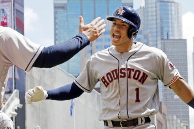 Houston Astros' Carlos Correa celebrates his three-run home run off Minnesota Twins pitcher Buddy Boshers in the fifth inning of a baseball game Thursday, Aug. 11, 2016 in Minneapolis. (AP Photo/Jim Mone)