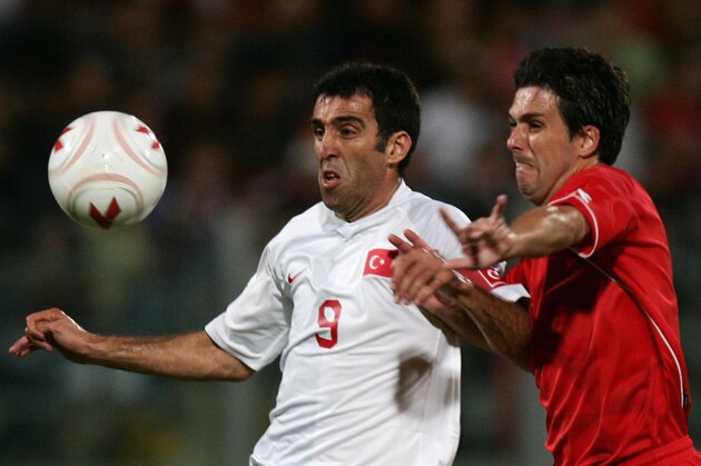 Hakan Sukur (L) of Turkey fights for the ball with Brian Said (R) of Malta during their Euro 2008 qualification Group C match at the Ta'Qali stadium in Valletta, Malta, 08 September 2007.AFP PHOTO/MUSTAFA OZER (Photo credit should read MUSTAFA OZER/AFP/Getty Images)